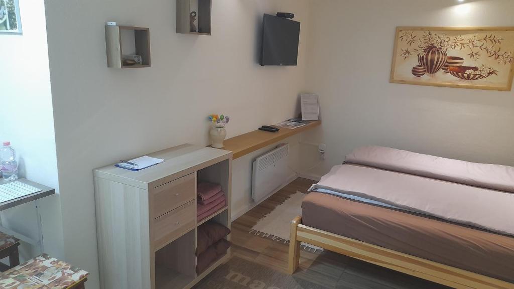 Posteľ alebo postele v izbe v ubytovaní Magnolia apartman