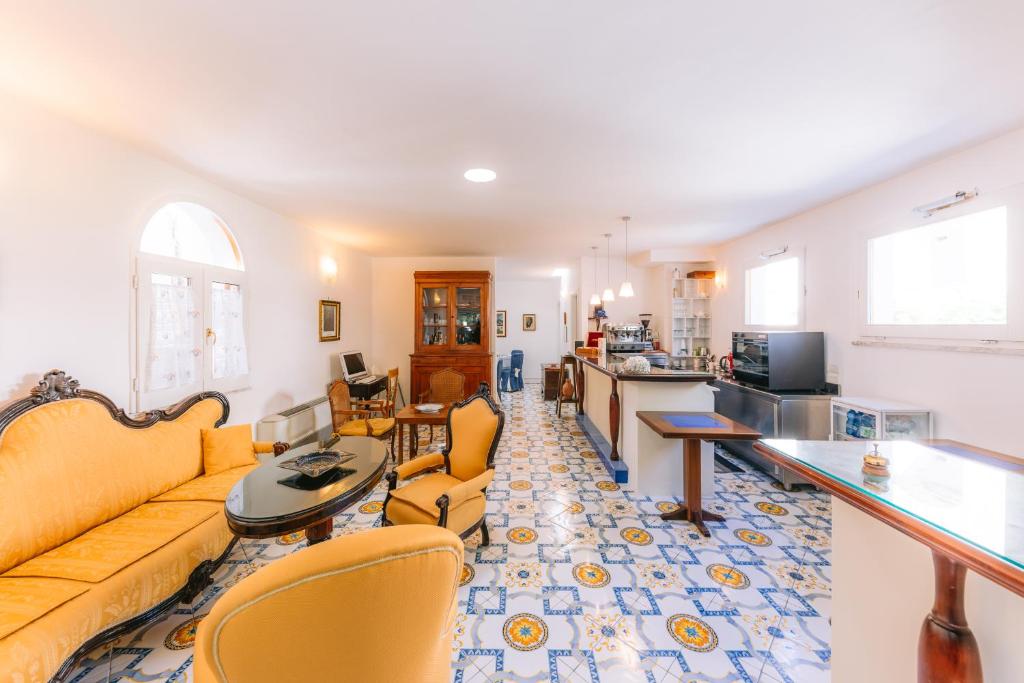 a living room with a couch and a table at Hotel Toro in Ravello