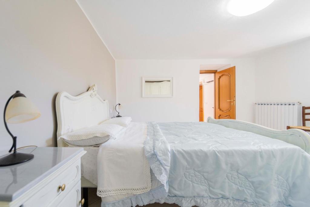 Posteľ alebo postele v izbe v ubytovaní CASA VACANZA IL PORTICO