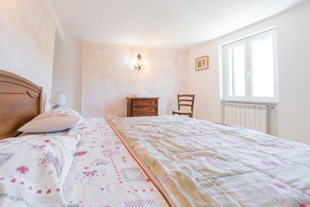 Posteľ alebo postele v izbe v ubytovaní CASA VACANZA IL PORTICO
