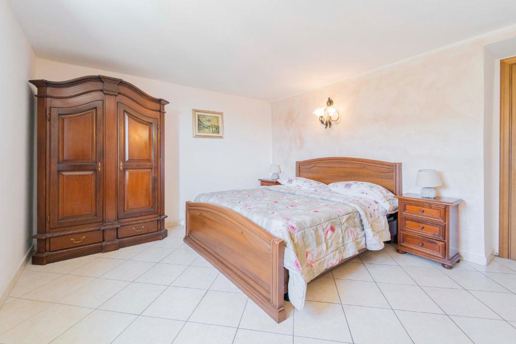 Posteľ alebo postele v izbe v ubytovaní CASA VACANZA IL PORTICO