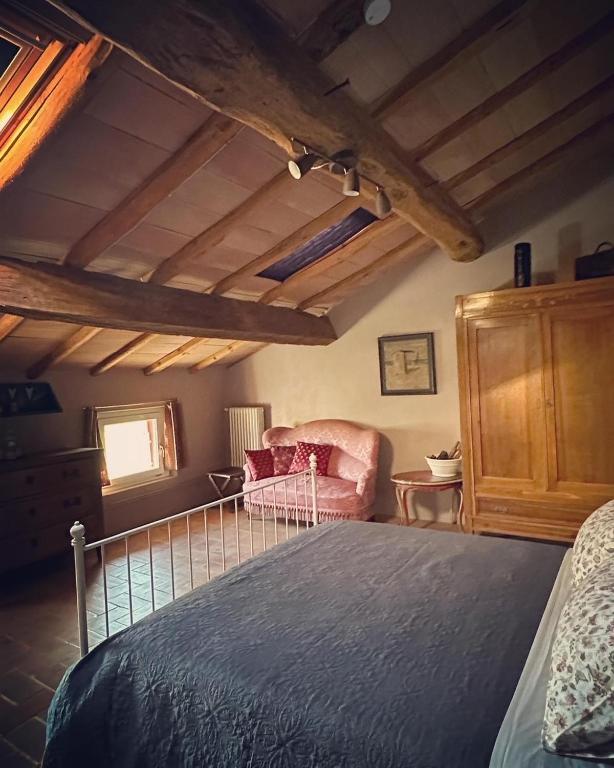 Postel nebo postele na pokoji v ubytování B&B Podere Merlo