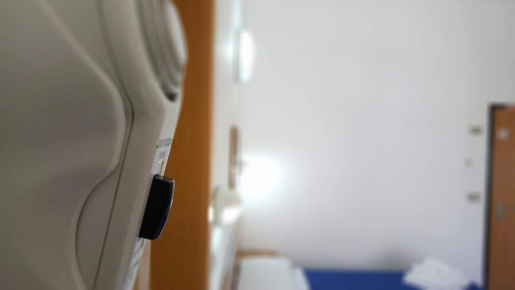 Postel nebo postele na pokoji v ubytování Hotel Venezia Beach