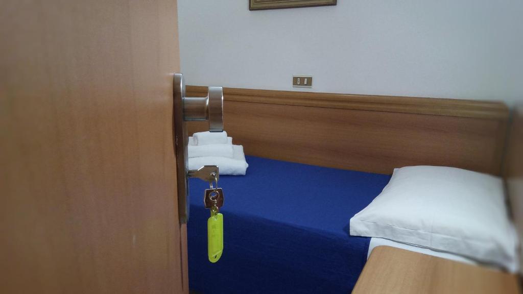 Postel nebo postele na pokoji v ubytování Hotel Venezia Beach