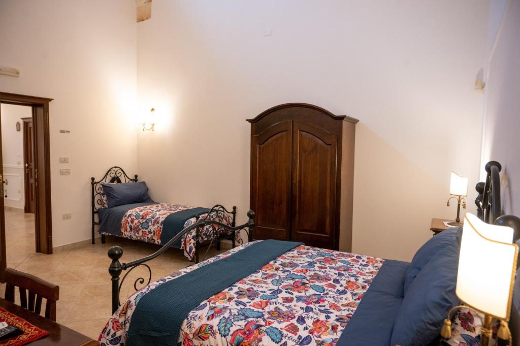 Postel nebo postele na pokoji v ubytování Corcioli B&B
