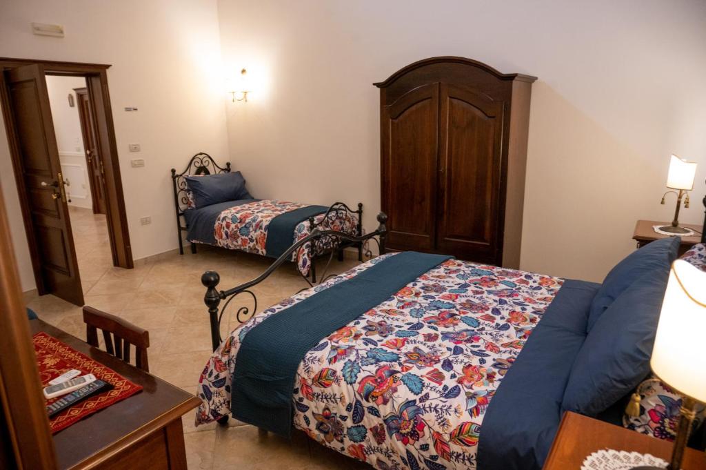 Postel nebo postele na pokoji v ubytování Corcioli B&B