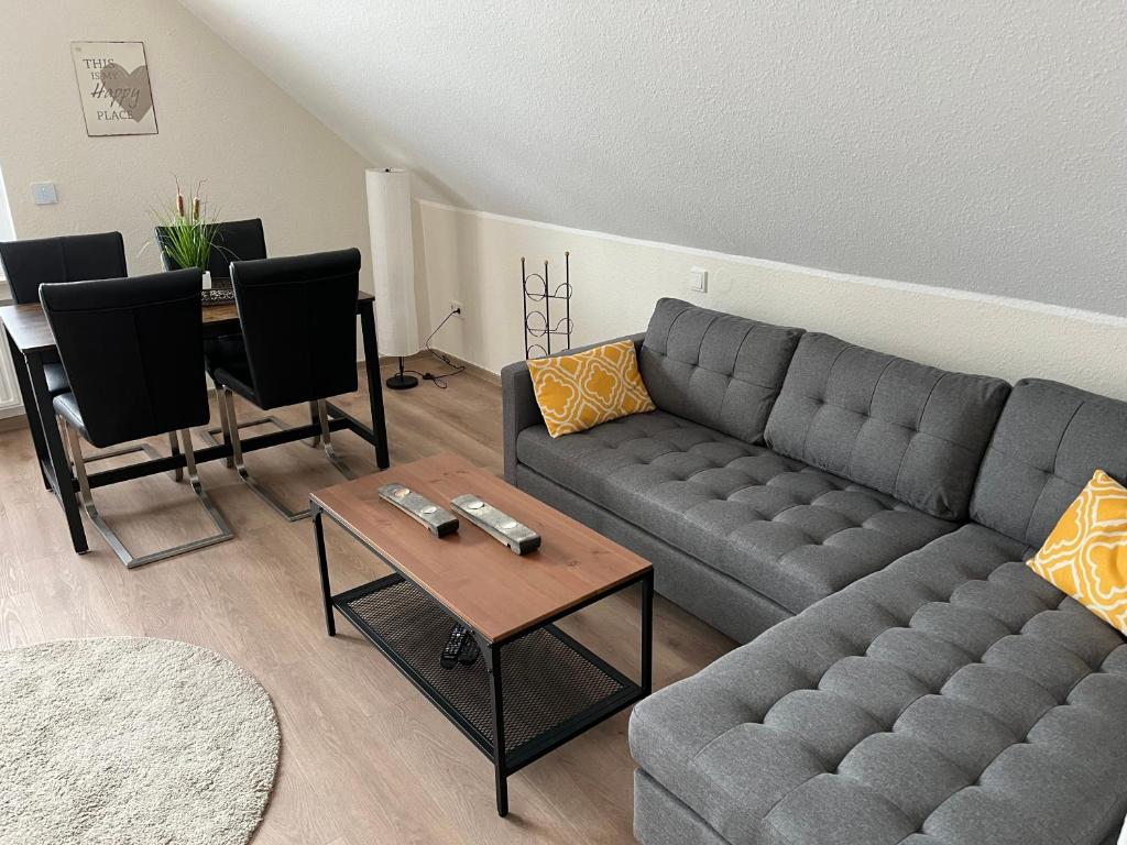 a living room with a couch and a table at Ferienwohnung Christa in Bullay