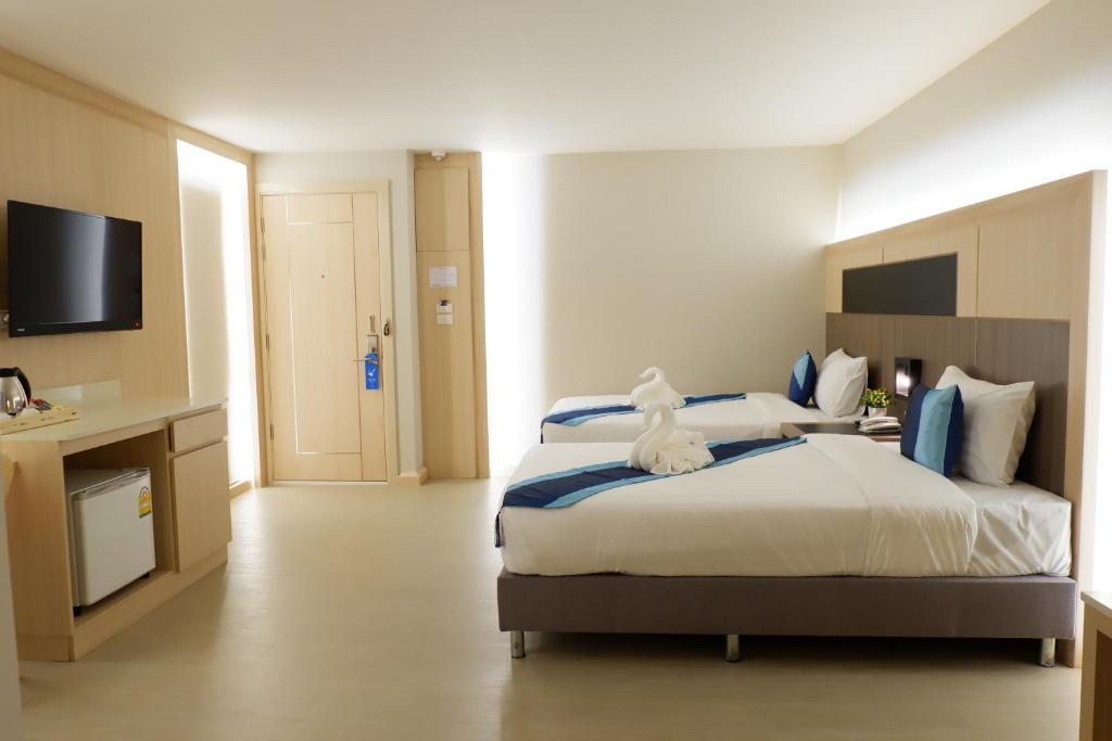 Postel nebo postele na pokoji v ubytování O2 Luxury Hotel