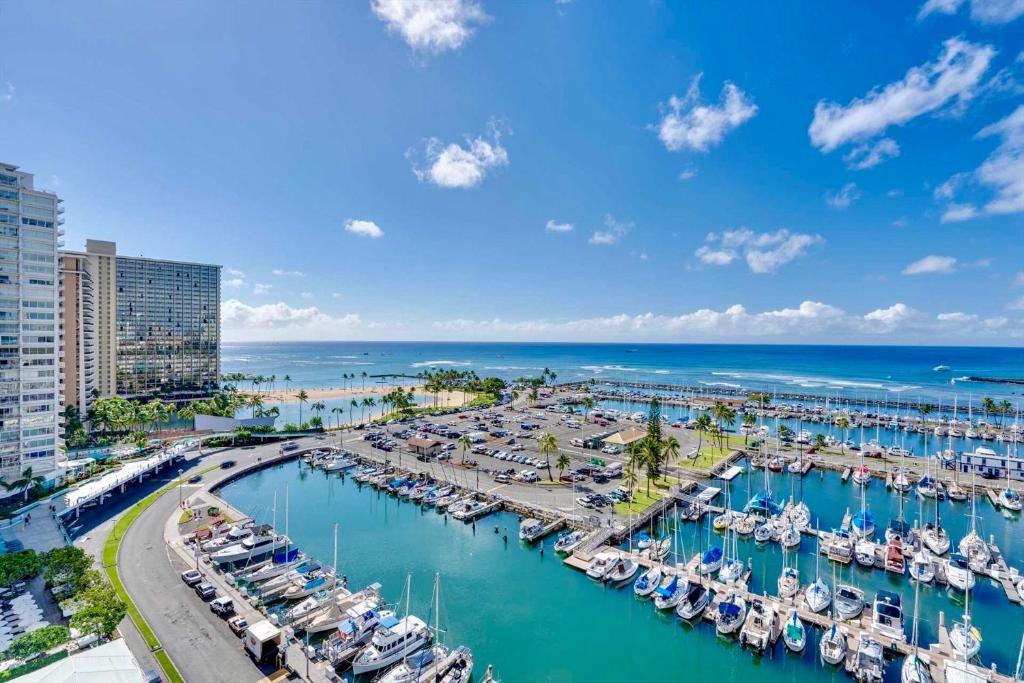 an aerial view of a marina with boats in the water at *Remodeled Oceanfront in Waikiki - Ilikai Marina in Honolulu