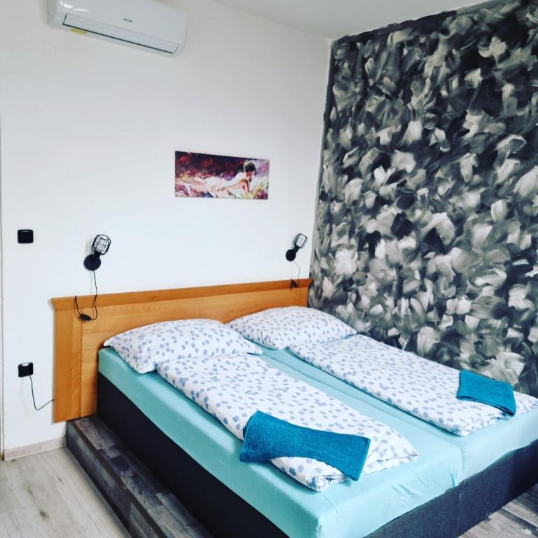 Postel nebo postele na pokoji v ubytování Penzion a Víno