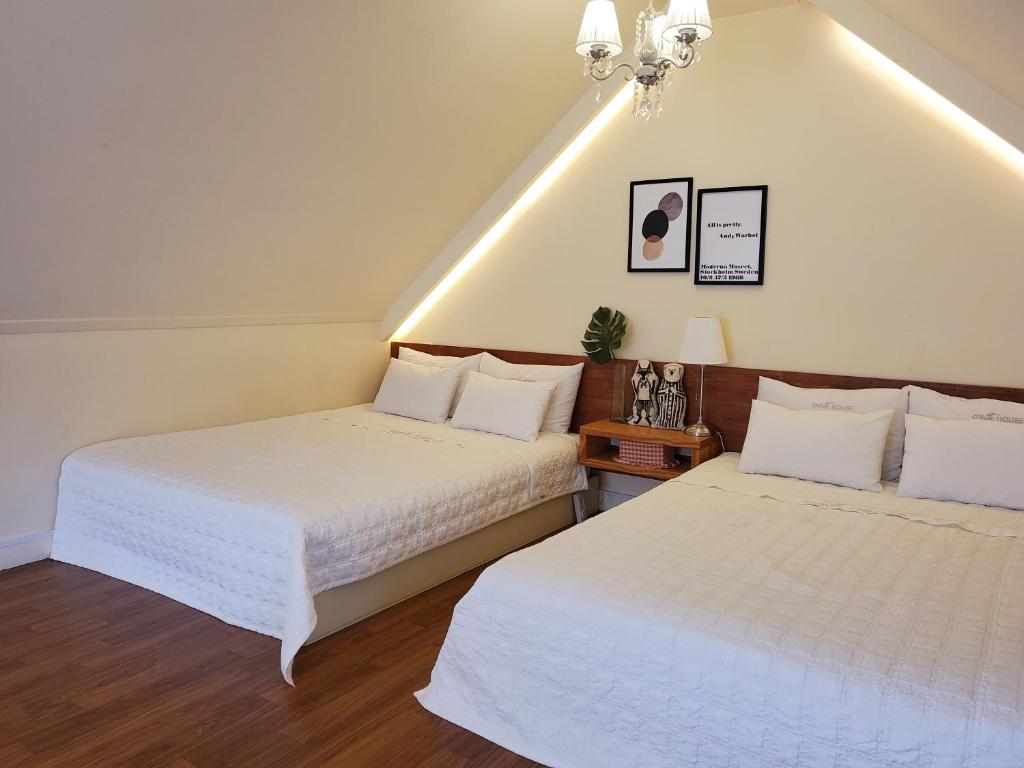 Postel nebo postele na pokoji v ubytování Olive Vanilla Pension