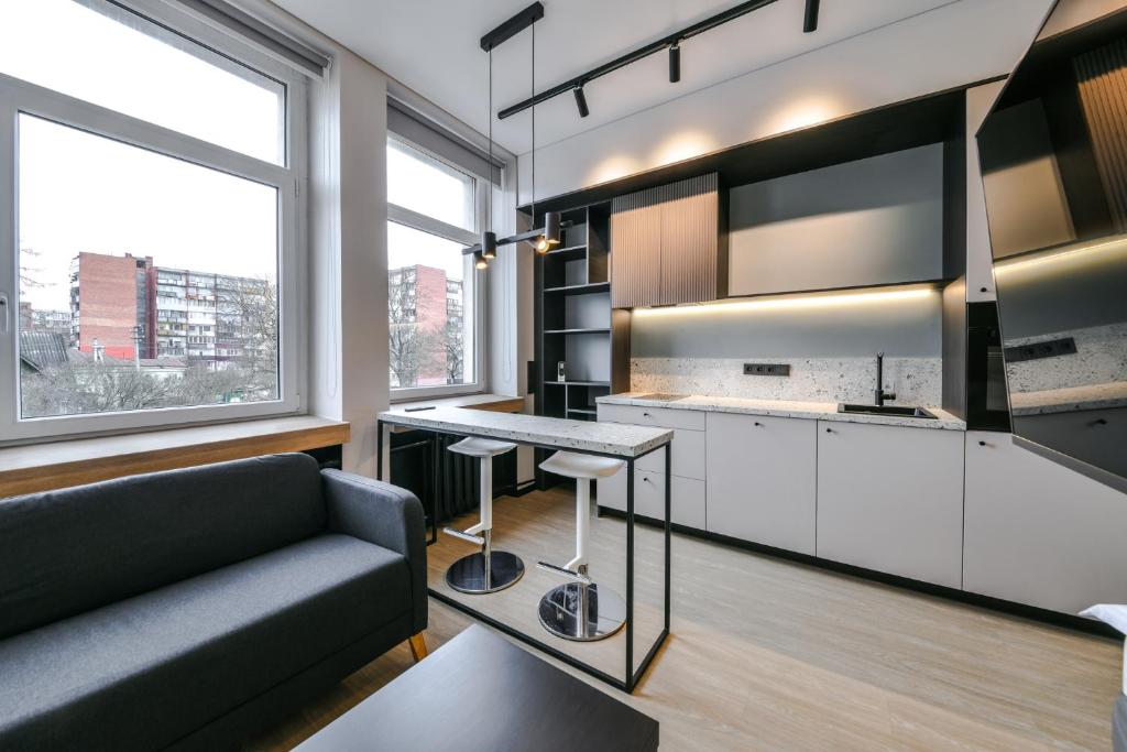 a living room with a couch and a table at Apartments in Vilnius in Vilnius