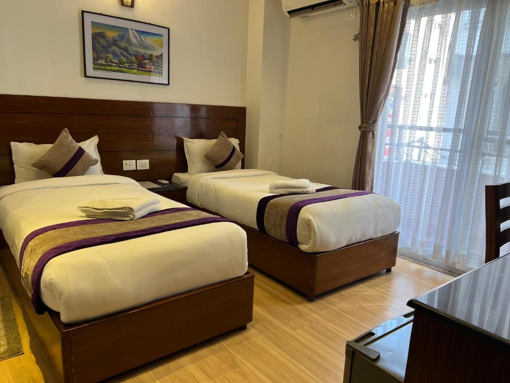 Postel nebo postele na pokoji v ubytování Hotel New Era