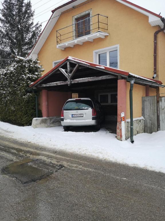 a car parked in the garage of a house at Apartmán u Moniky in Babín