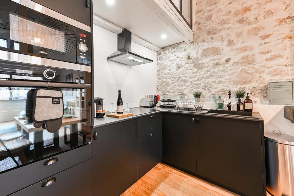Kuchyňa alebo kuchynka v ubytovaní Le Loft Carnot - Apartment in the heart of the city