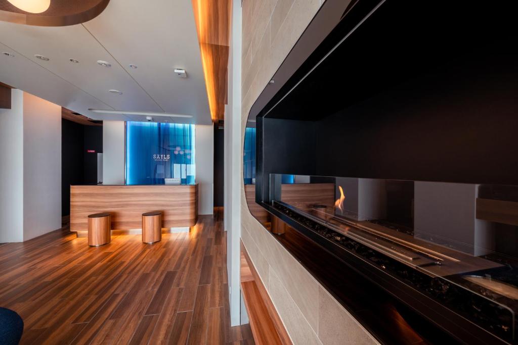 a view of a waiting room with a large fireplace at HOTEL SAILS in Osaka