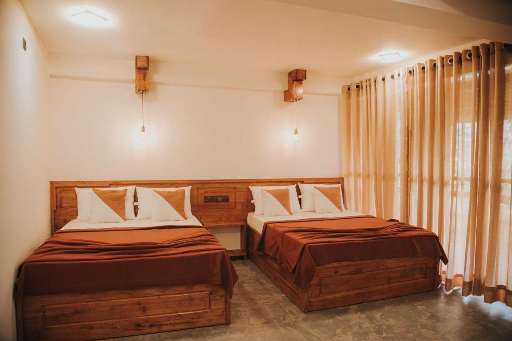 Postel nebo postele na pokoji v ubytování Ollie resort