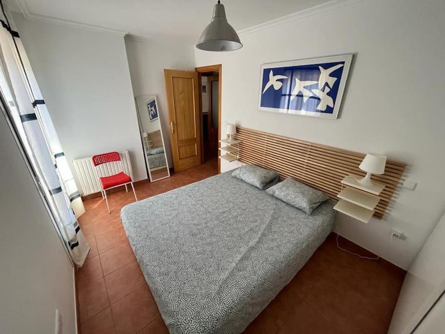 A bed or beds in a room at Apartamento Lagos Azules II
