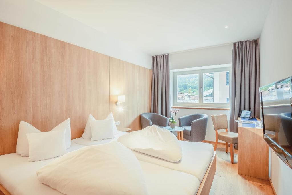 Postel nebo postele na pokoji v ubytování Hotel Kendler