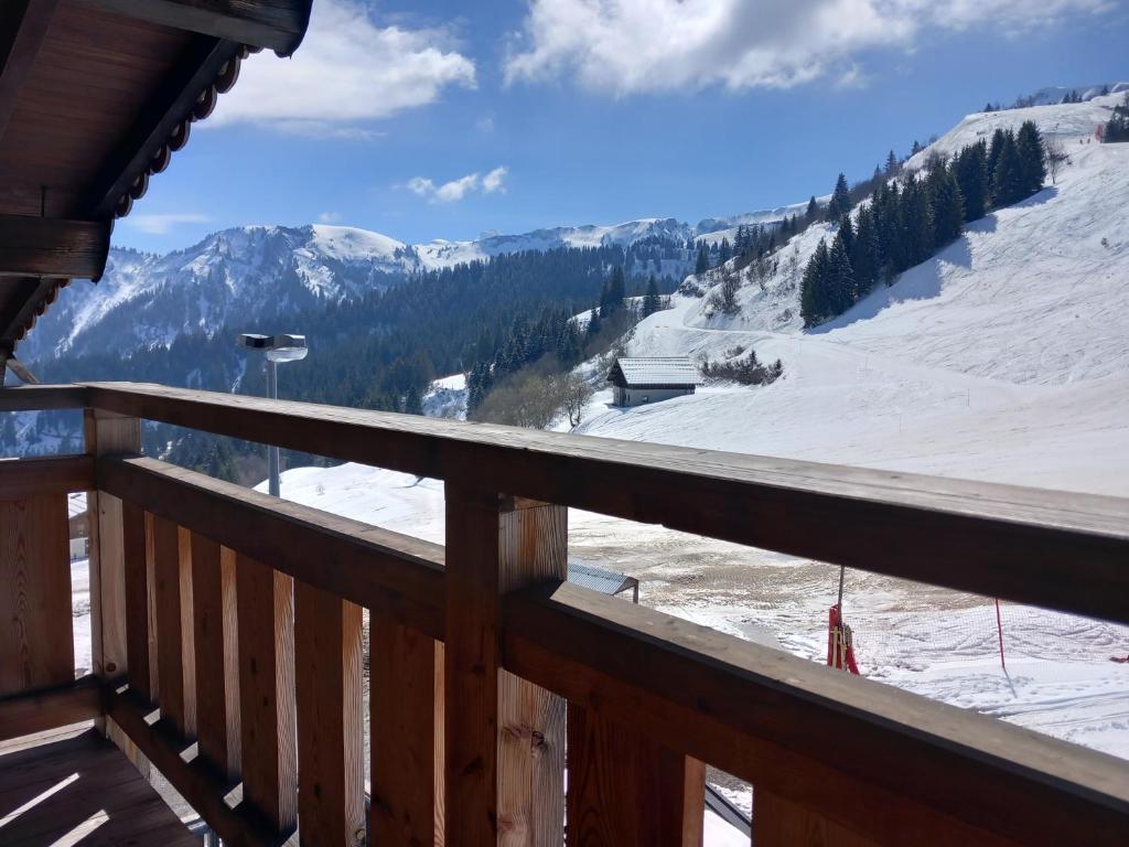 a view from the balcony of a ski resort at Appartement Le Pic in Samoëns