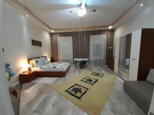 Postel nebo postele na pokoji v ubytování Edina Apartman