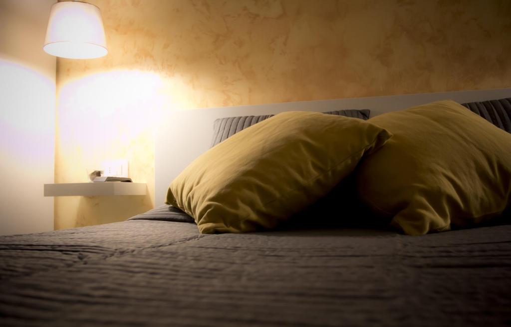 A bed or beds in a room at De Guestibus