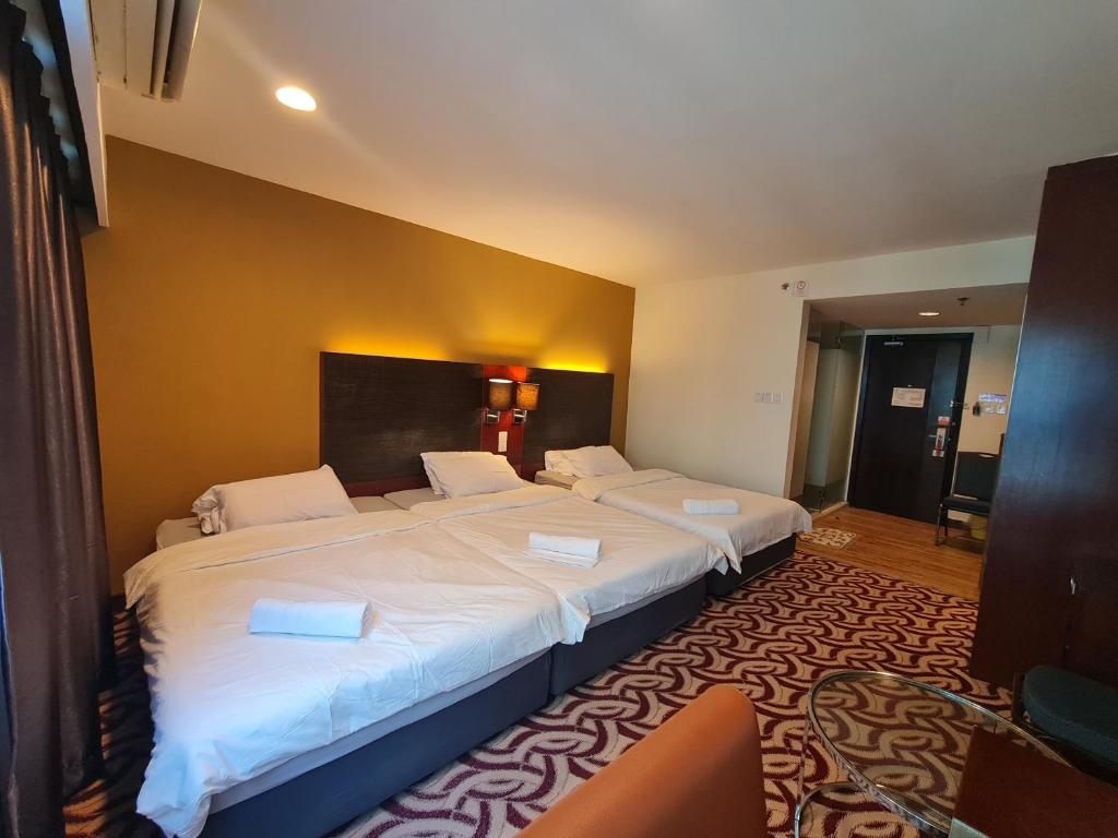 Postel nebo postele na pokoji v ubytování SUN GARDEN Studio and Residences at South China Sea Place Suites