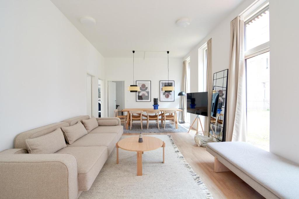 a living room with a couch and a table at Great Apt · Near Beach · CPH in Copenhagen