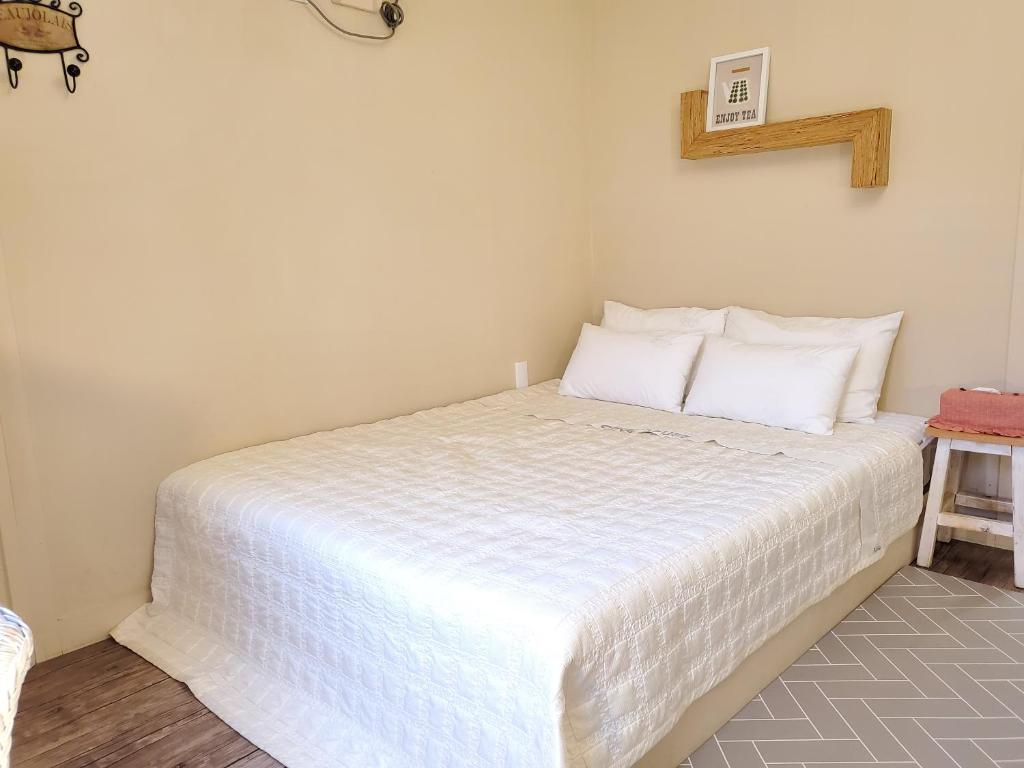 Postel nebo postele na pokoji v ubytování Olive Vanilla Pension