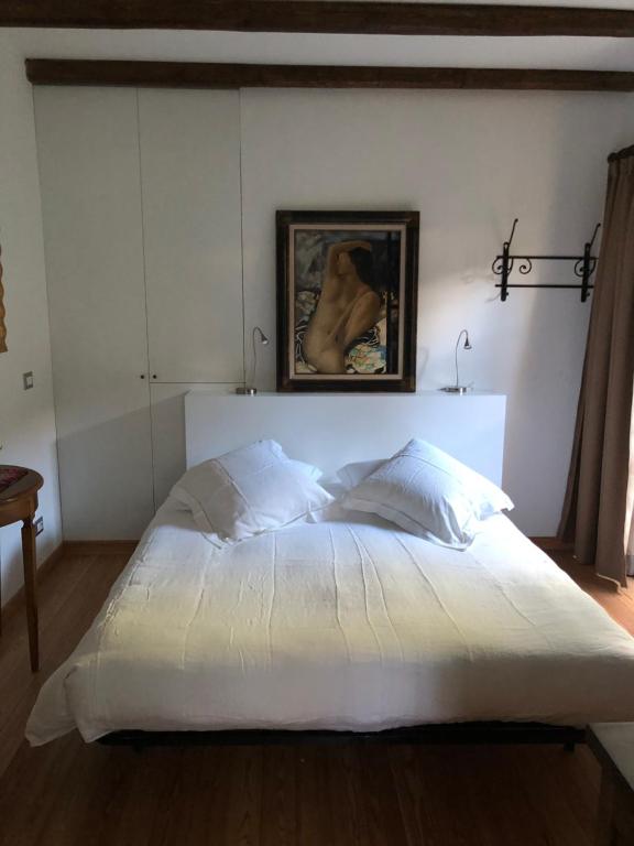 Postel nebo postele na pokoji v ubytování Alveluu ristorante e suites