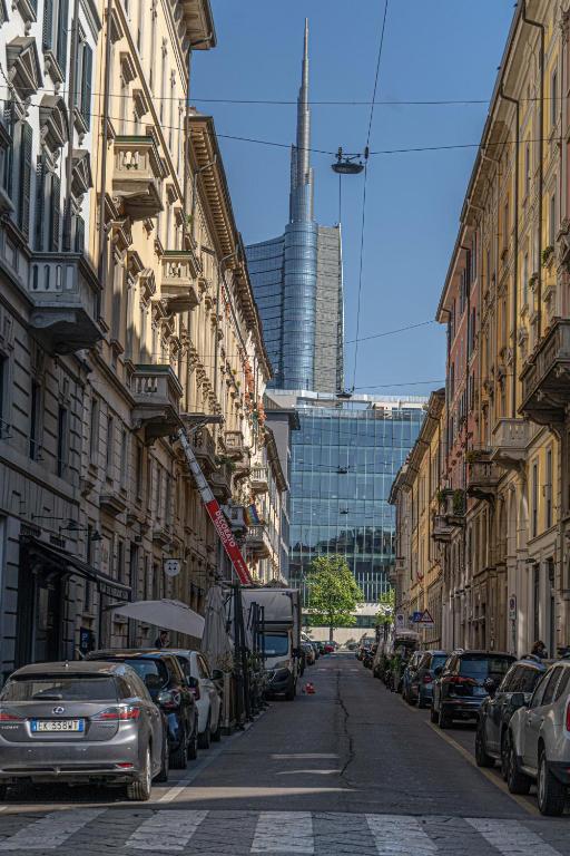 a city street with cars parked on the sides of buildings at Solferino34 in Milan