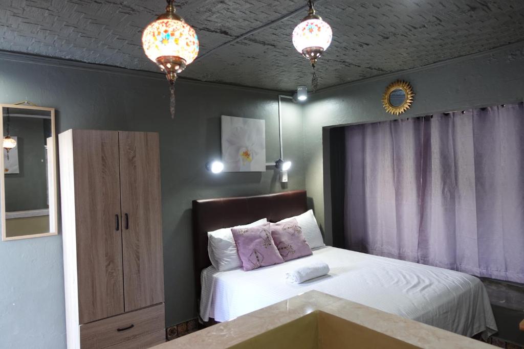Postel nebo postele na pokoji v ubytování D Sanctum Resort