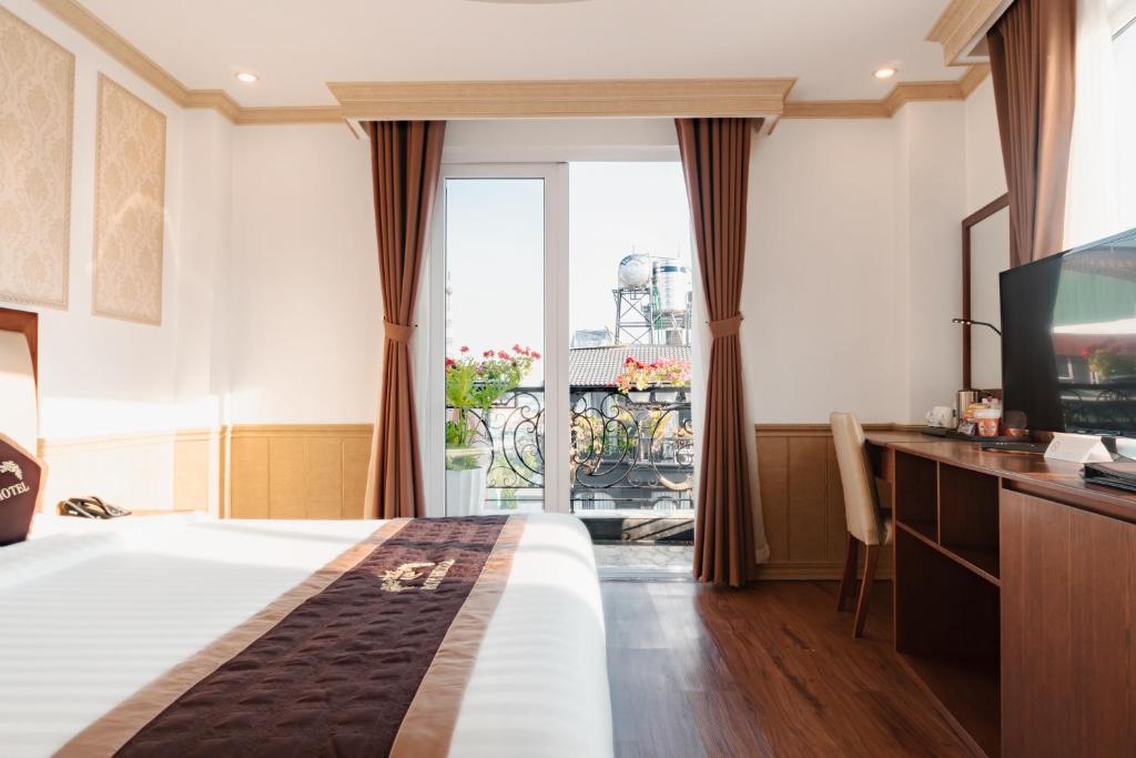 Postel nebo postele na pokoji v ubytování Roy Dala Hotel