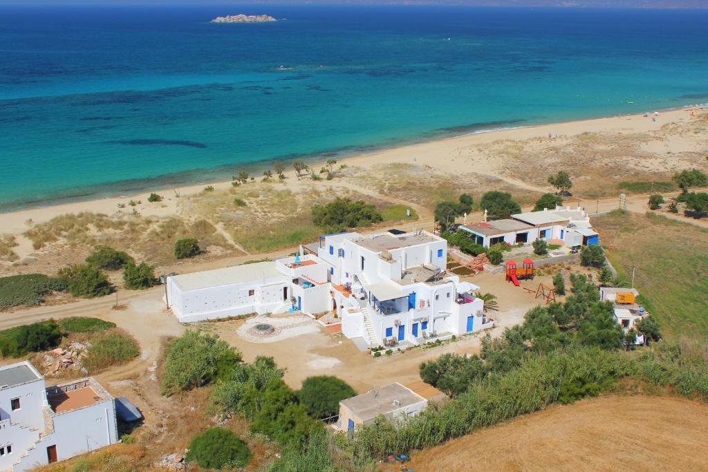 an aerial view of a beach with white houses and the ocean at Filippa Studios in Plaka