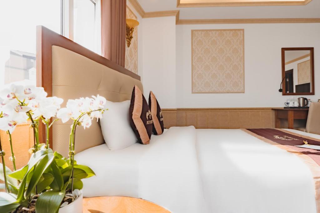 Postel nebo postele na pokoji v ubytování Roy Dala Hotel