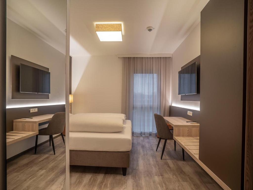 TV a/nebo společenská místnost v ubytování Motel Waidhofen an der Thaya