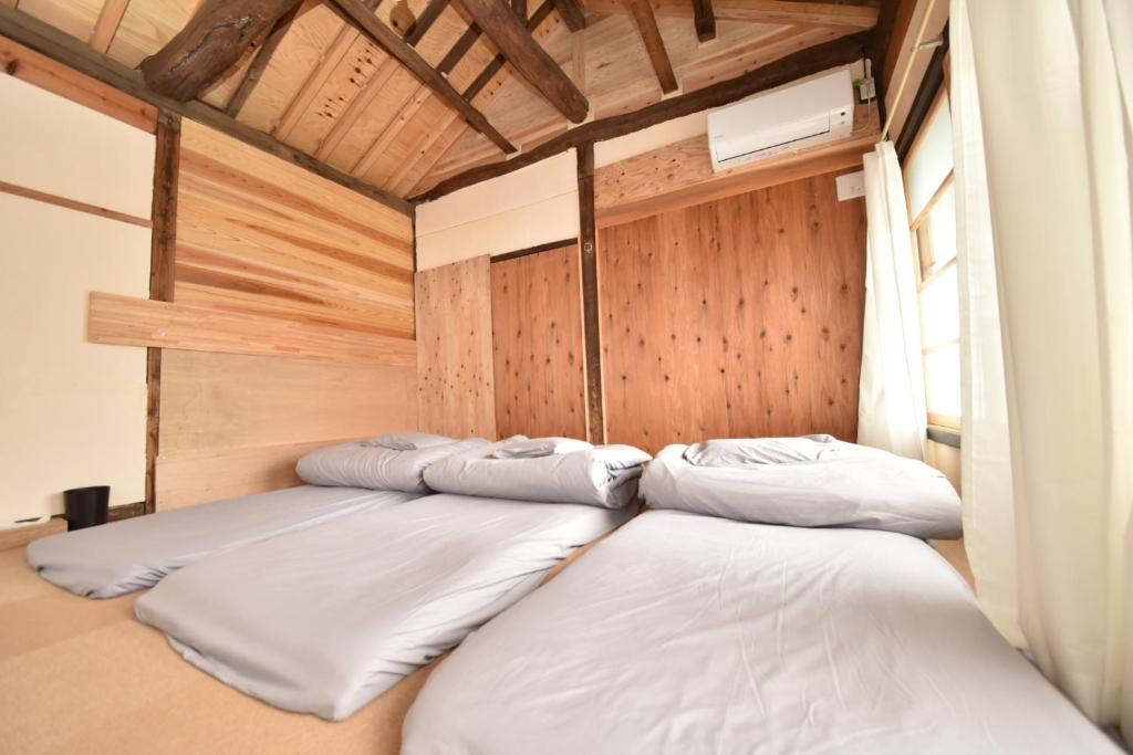 Postel nebo postele na pokoji v ubytování Dive INN Kiryu