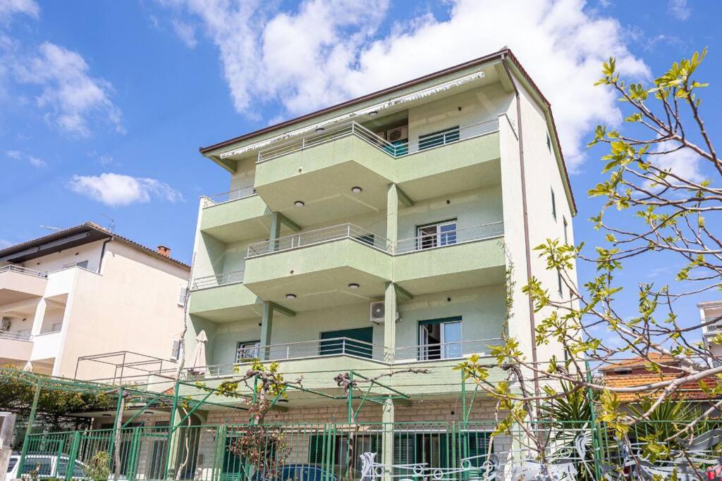 a tall building with balconies on the side of it at Apartment Blue in Stobreč