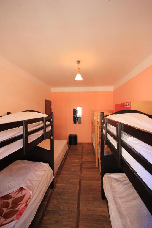 Postel nebo postele na pokoji v ubytování Center Hostel and Tours