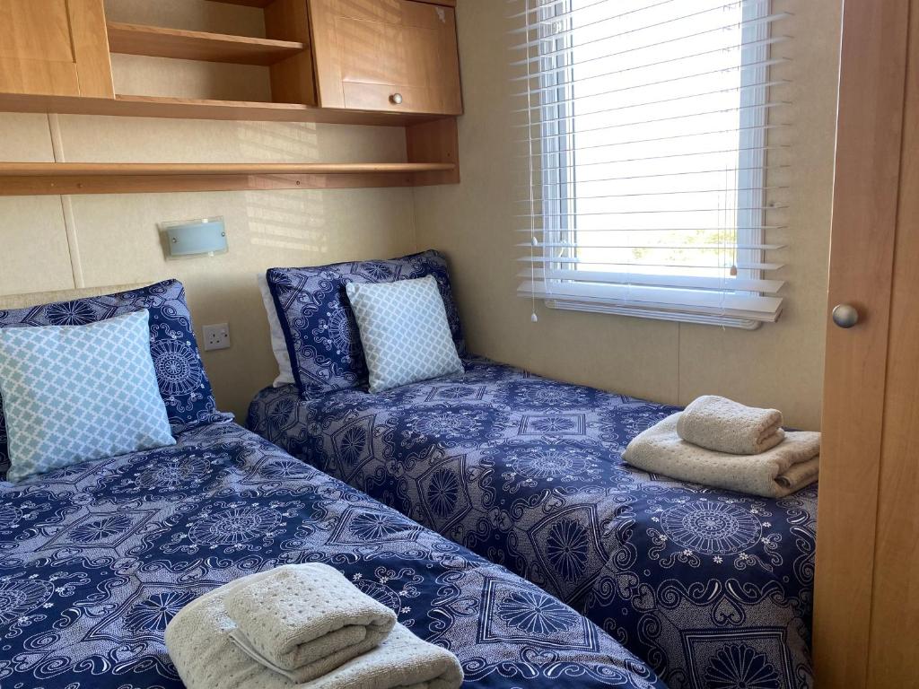 Letto o letti in una camera di Earls View Caravan
