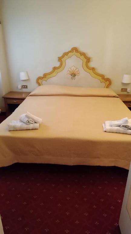 Posteľ alebo postele v izbe v ubytovaní Hotel Posta R.T.A.
