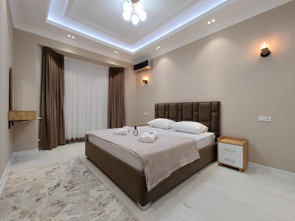 BAURUM Family Apartments tesisinde bir odada yatak veya yataklar
