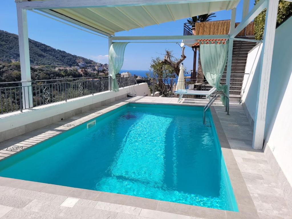 a swimming pool on a house with a view at Relais Cannavacciuolo in Vico Equense