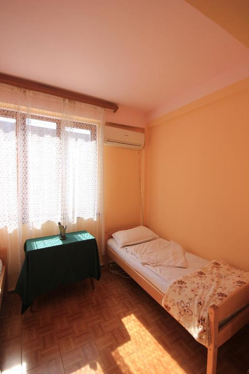 Postel nebo postele na pokoji v ubytování Center Hostel and Tours