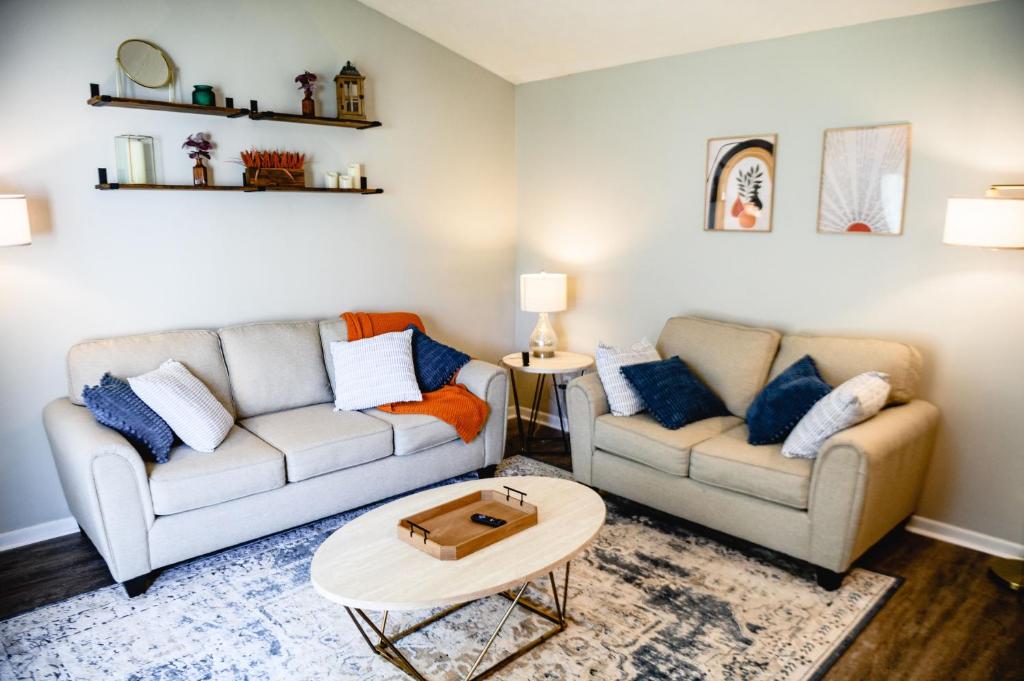 a living room with two couches and a coffee table at Urban Cottage: Homey & Convenient in Huntington