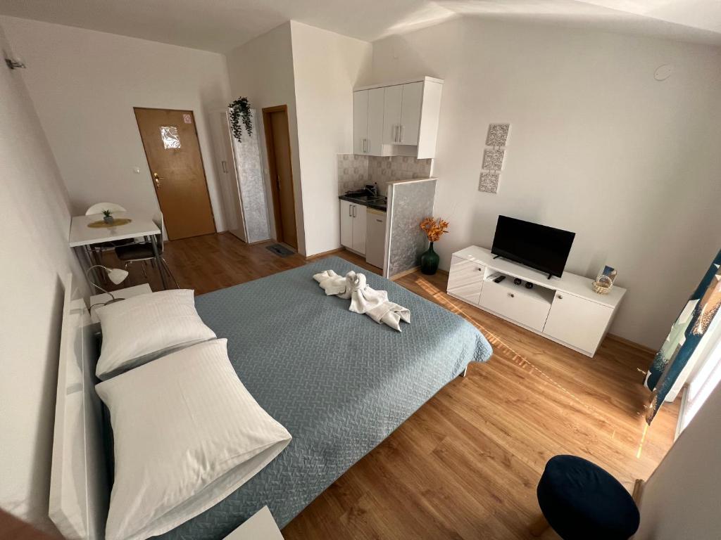Postel nebo postele na pokoji v ubytování Apartments Mateljak