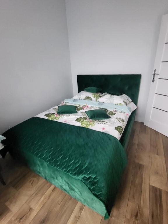 Posteľ alebo postele v izbe v ubytovaní Nest Apartament