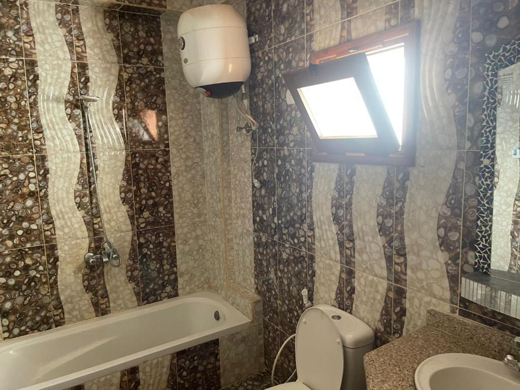 A two-bedroom duplex with a roof