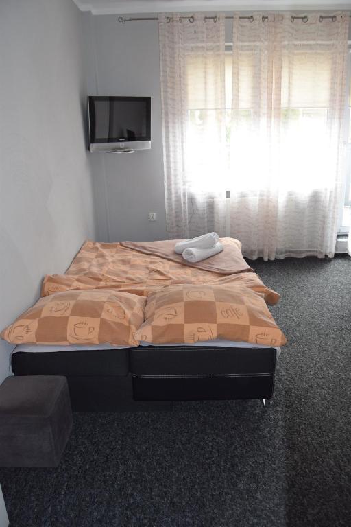 Posteľ alebo postele v izbe v ubytovaní Apartamenty Hejszowina