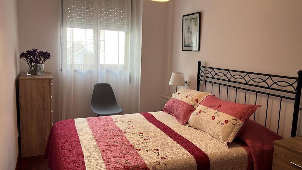 Posteľ alebo postele v izbe v ubytovaní APARTAMENTO A PIE DE PLAYA